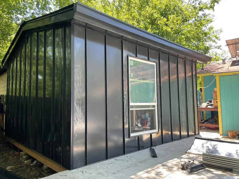 Black standing seam metal wall panels for Roof Inspection in Artesia